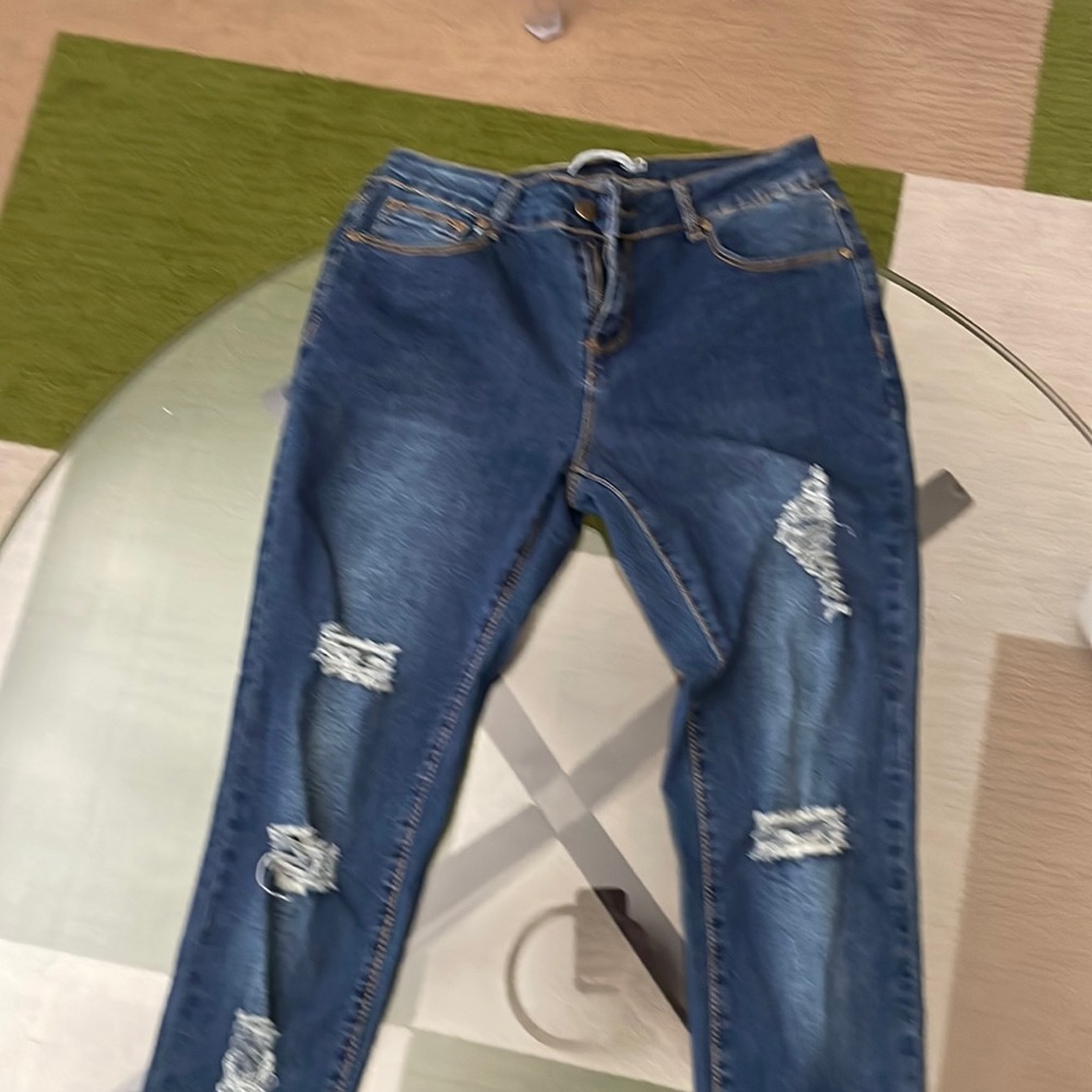 Blue distressed ankle jeans. Never worn. Tags still on. Bought at boutique. Sz 9